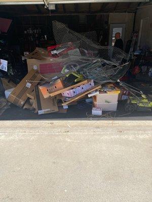 the stuff on the garage floor in front is all they added to the truck along with a loveseat.