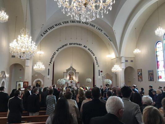 Everyone standing to pay respect in the ceremony.