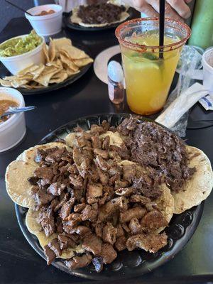 Barbacoa, bistec and tripitas  Mango margarita  Guacamole and chips