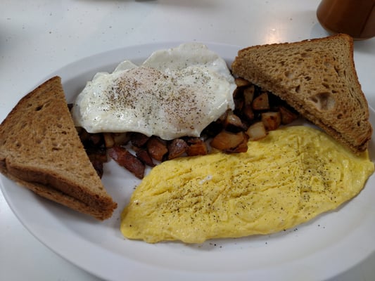 Two eggs over easy, well done homefries, 2 scrambled, wheat toast!