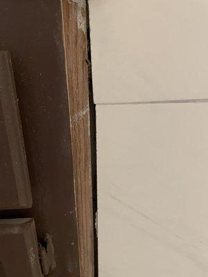 space between tiles and wood