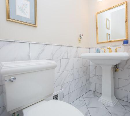 Marble wainscoting in powder room