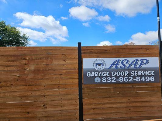 Sign with ASAP Garage Door Service name and phone