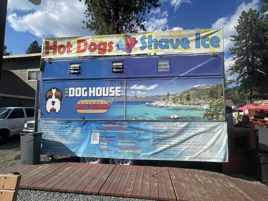 The Dog House Hot Dog and Shaved Ice kiosk truck stop.