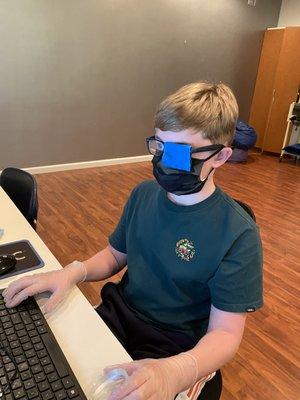 Patient using computer technology for visual saccades (eye movements).