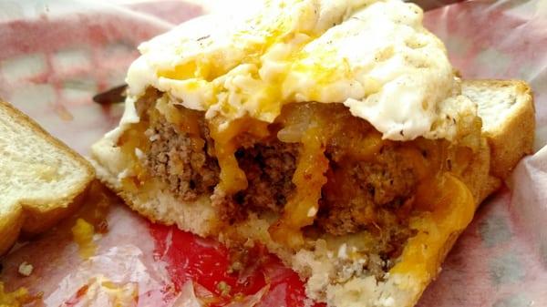 Half into the "Hangover Burger"- topped with bacon, egg, and hashbrowns. Yes. Just yes.