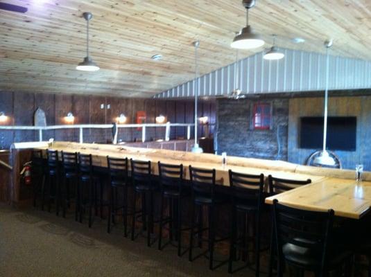 Upstairs bar area with meeting room in back