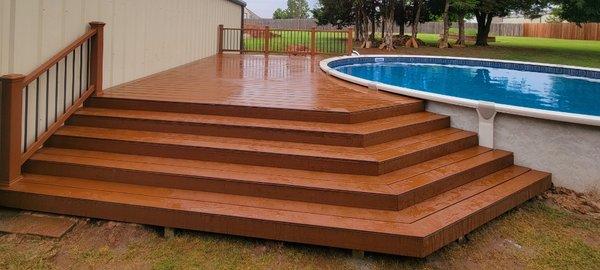 Contemporary composite pool deck with composite handrail.