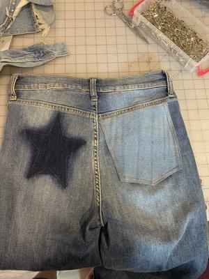 These jeans had a large star and my customer wanted to cover that up. I made a pocket out of another pair of jeans and she loved it!