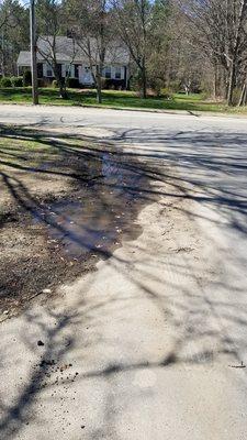 New flooding as a result of their lower driveway destroying our lawn