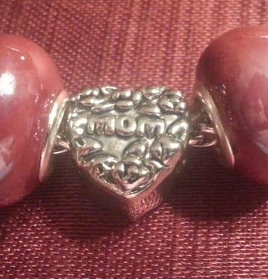 Silver "Mom" heart shaped tag bead closeup