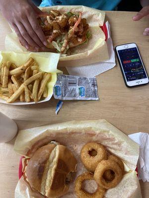 Mushroom Swiss burger with Onion rings, shrimp PO BOY with fries.