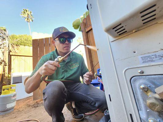 Soldering up the refrigeration lines on a Mitsubishi mini split compressor, for an install we did in Mission Hills