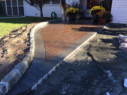 Paver Stone walkway installation from the driveway to the front porch.