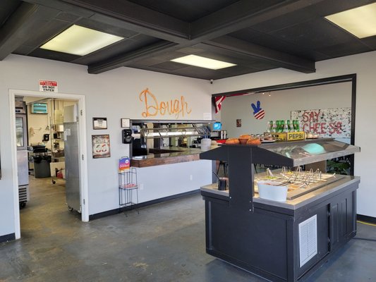 Salad bar on right, buffet window in center and kitchen through the door.