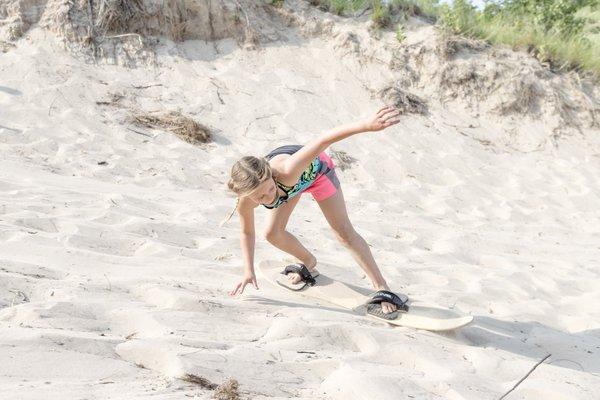 Third Coast Paddling has rental sandboards and sand sleds available to ride the dunes at Warren Dunes State Park in Michigan.