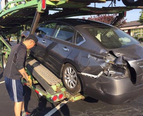 Car severely damaged while in the service of CAA Auto Transport