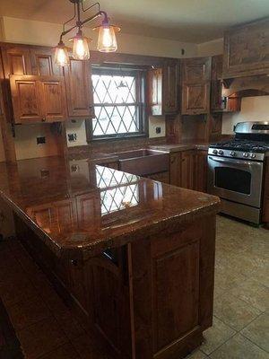 New kitchen cabinets and new concrete countertops, beautiful addition to the homeowner's beautiful log home.