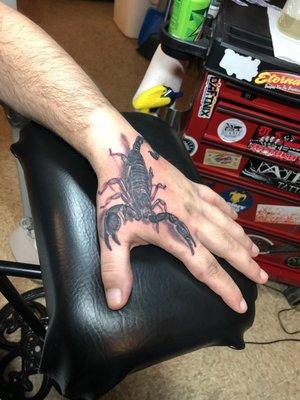 Scorpion Hand tattoo by Crawl