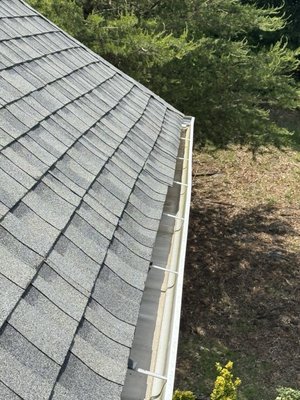 Improperly installed drip edges causing warped shingles 4 years later