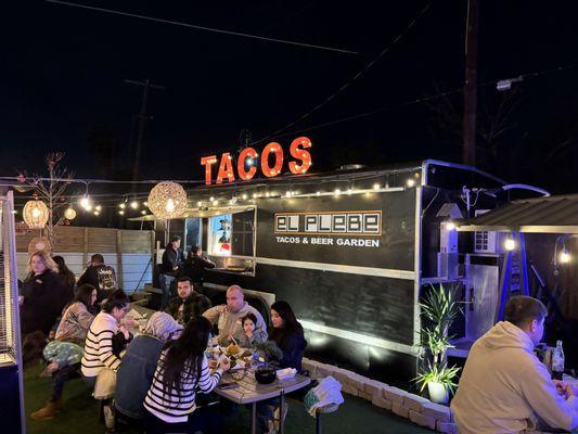 Taco truck atmosphere but is sit down dining.  A great combination.