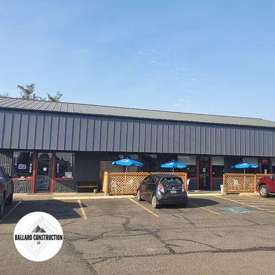 Exterior remodel of Benny's Pizza Joint in Monroe, Oregon. Painted roof, painted building, and new sheet metal siding.