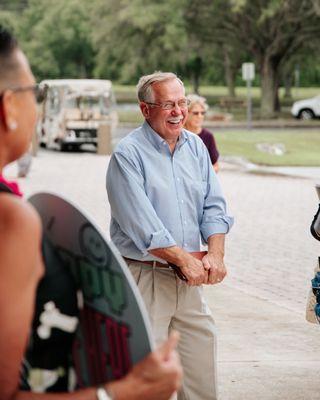 Cute man smiling as he hangs out at the entrance of SBC!