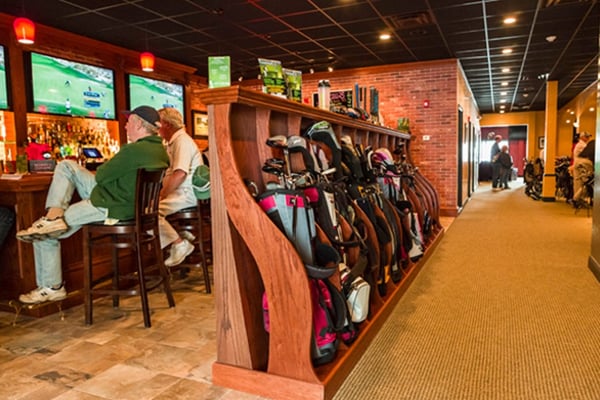 When you walk in there is the sports bar area on your left, and then the bays where you golf on your right.