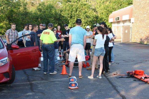 Ken (Instructor) teaches a group of students about extricating patients from vehicles