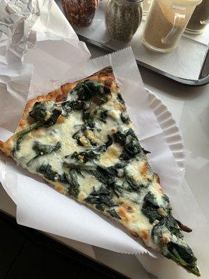 Awesome spinach slice of pizza