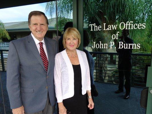 Attorney John P. Burns with satisfied client, Peg Garrison.