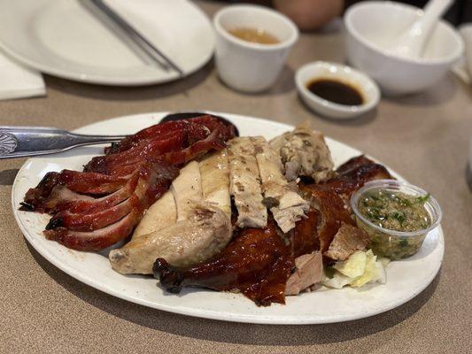 Three types of meats with a side of white rice