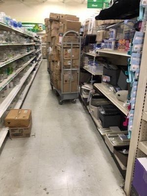 Shelves are bare and boxes of products are stacked high in the aisles!!