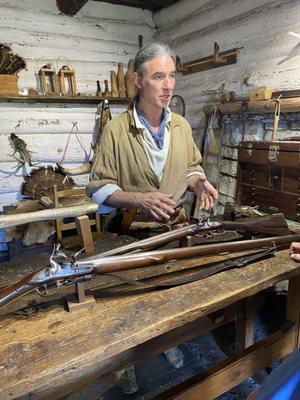 Interpreter explains the making of early weapons.