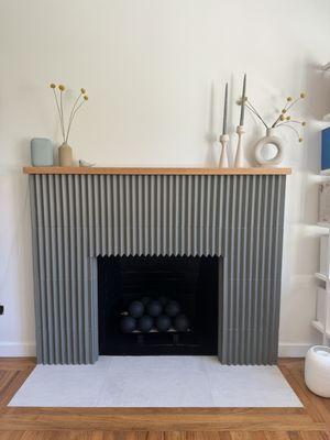 Fireplace surround, threshold, and conversation to gas