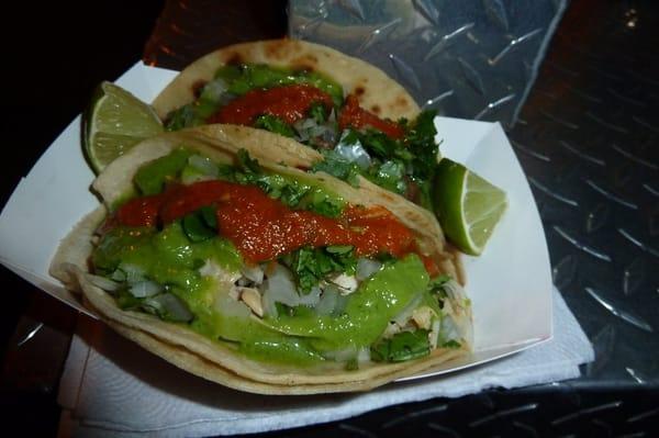 Yummy salsa verde, salsa and onions on top.  No guac here.