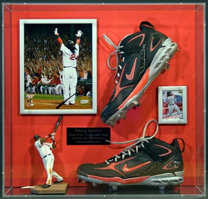 We framed these signed Manny Ramirez world series sneakers with photos and action figures.