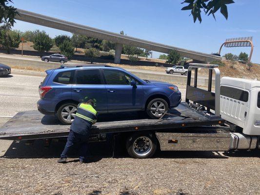 Tow truck and Subaru Forester