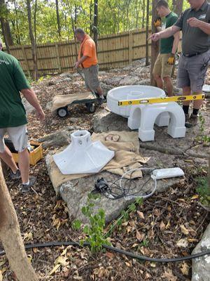 The staff setting up and installing the fountain I purchased