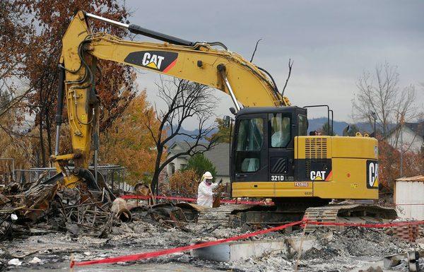 Heavy equipment fire debris cleaning