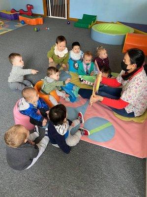 Our babies love circle time-reading!