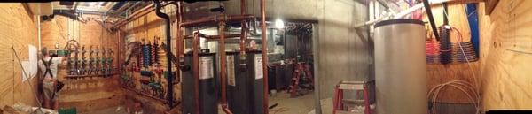 Water to water geothermal system, radiant floor heat with chilled water air conditioning.