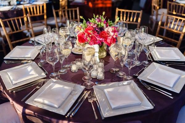 centerpiece with table setting (orchids, roses, lisianthus, hydrangea, stock)