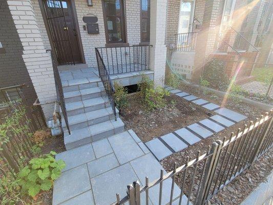 Walkway, path, steps, and porch in bluestone.