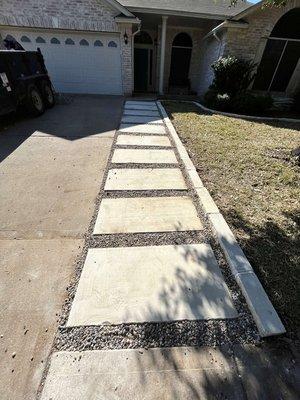 Stepping stone installed with gravel.