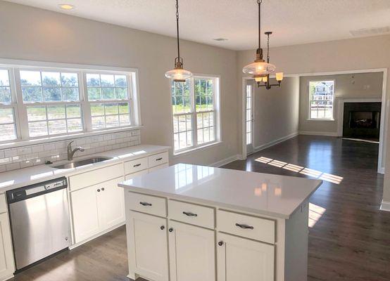 Our Monroe plan kitchen with  quartz counter tops & white customer cabinetry!