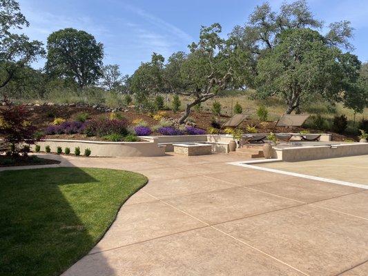 Custom fire pit, and elevated seating area.