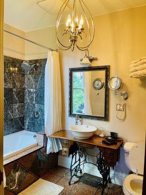 Bathroom with soaking tub, shower, bathrobes, amazing plumbing