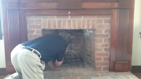 Inspecting fireplace