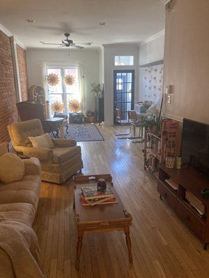 Green armchair and coffee table from Take Me Home